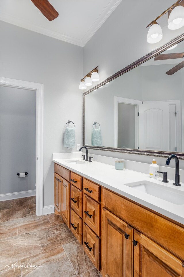 kitchen with baseboards, a sink, gray cabinetry, and stainless steel appliances