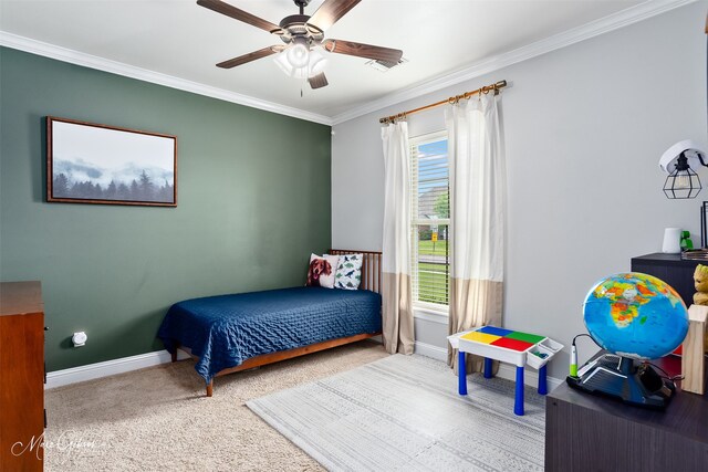 bedroom featuring a tray ceiling, light colored carpet, and ornamental molding