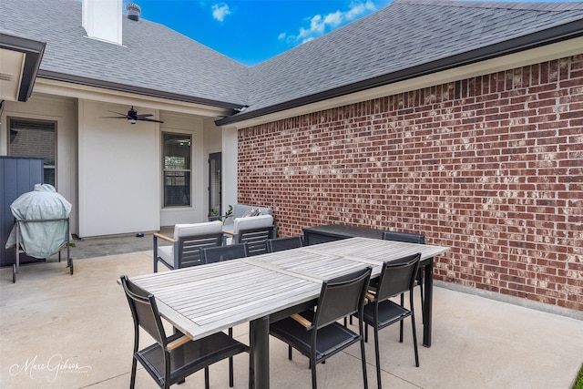 view of patio with a ceiling fan and outdoor dining area