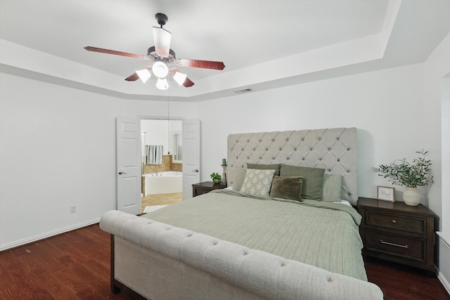 5729 New Castle Dr, Richardson, TX 75082 - bedroom with dark wood-style flooring, baseboards, visible vents, and a raised ceiling