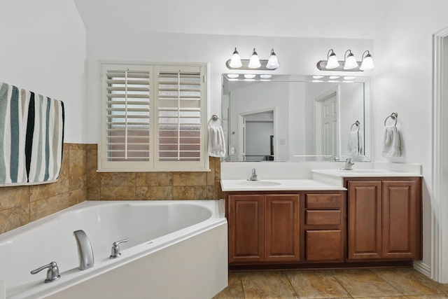 5729 New Castle Dr, Richardson, TX 75082 - bathroom with a sink, a garden tub, and double vanity