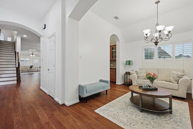 5729 New Castle Dr, Richardson, TX 75082 - living area featuring dark wood-type flooring, a notable chandelier, and stairway