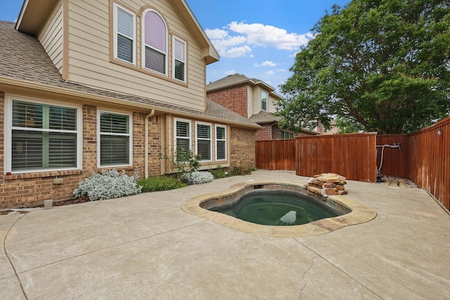 5729 New Castle Dr, Richardson, TX 75082 - view of swimming pool with a patio, an in ground hot tub, and a fenced backyard