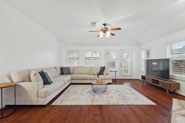 5729 New Castle Dr, Richardson, TX 75082 - living area featuring ceiling fan, dark wood finished floors, a stone fireplace, baseboards, and visible vents