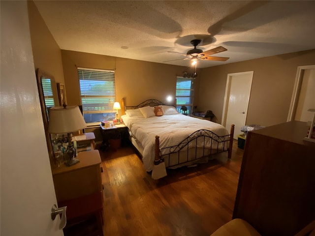 bedroom with a ceiling fan and wood finished floors