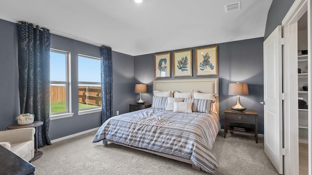 bedroom featuring visible vents, carpet, and baseboards