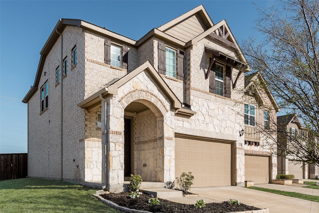 view of front facade with a garage, concrete driveway, and stone siding