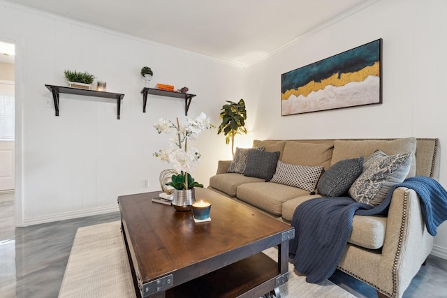 living room featuring wood finished floors, baseboards, and ornamental molding