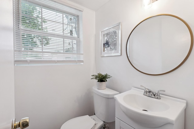 bathroom with toilet and vanity