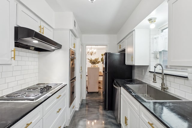 kitchen with under cabinet range hood, a sink, stainless steel appliances, decorative backsplash, and white cabinets