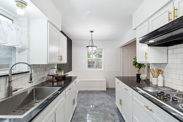 kitchen featuring ventilation hood, a sink, electric cooktop, and decorative backsplash