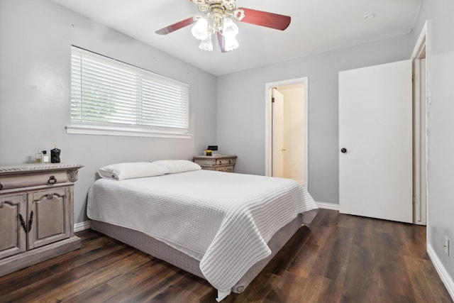 bedroom featuring dark wood-style flooring, baseboards, and ceiling fan