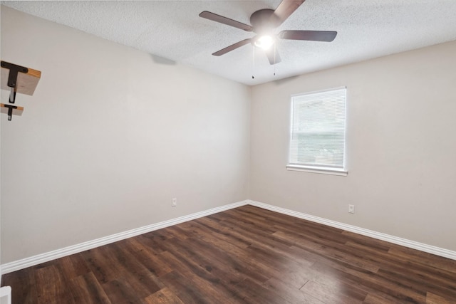 unfurnished room featuring dark wood-type flooring, baseboards, ceiling fan, and a textured ceiling