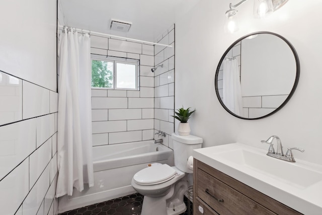 full bath with toilet, shower / bath combo, vanity, and tile patterned flooring