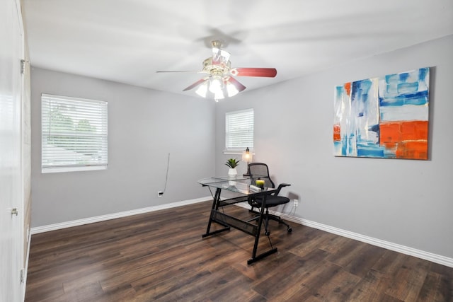 office area featuring dark wood-style floors, ceiling fan, and baseboards