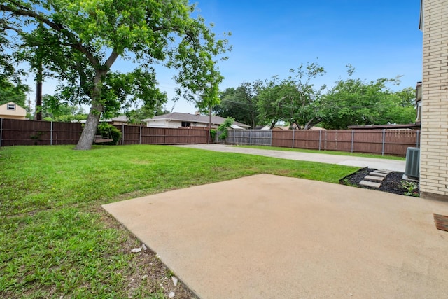 view of yard featuring a patio area and central AC
