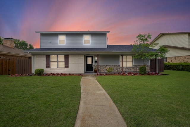traditional home with roof with shingles