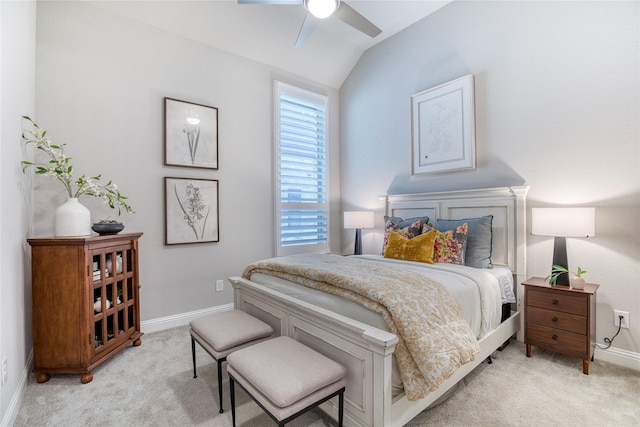bedroom with baseboards, light colored carpet, ceiling fan, and lofted ceiling