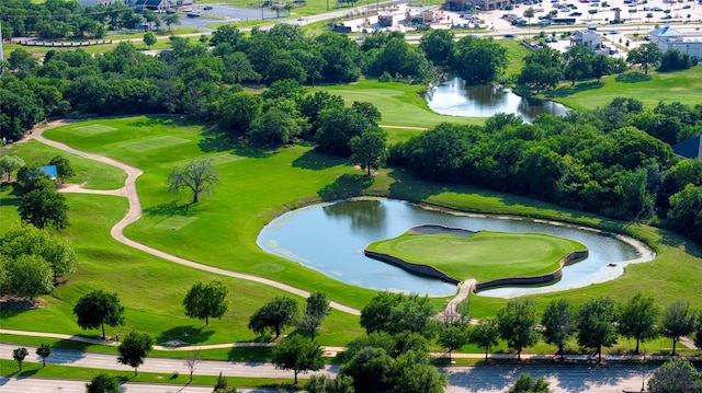 bird's eye view featuring a water view and view of golf course