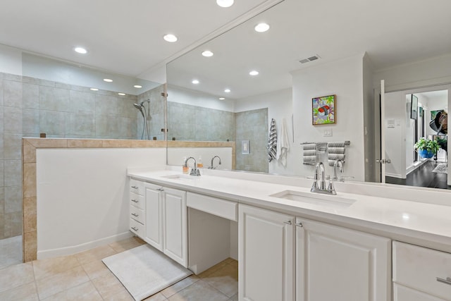 bathroom with a walk in shower, vanity, tile patterned floors, recessed lighting, and visible vents
