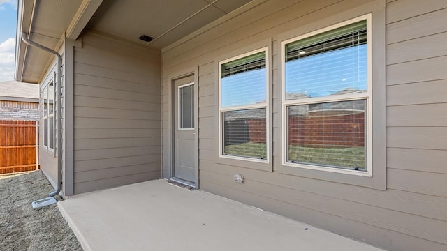 view of patio / terrace featuring fence