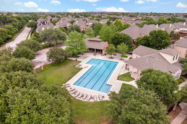 birds eye view of property with a residential view
