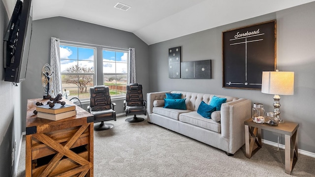 living room with carpet floors, baseboards, visible vents, and lofted ceiling