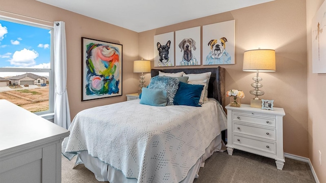 bedroom featuring carpet floors and baseboards