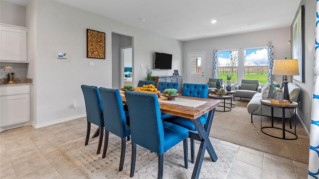 dining area with baseboards, recessed lighting, and light tile patterned flooring