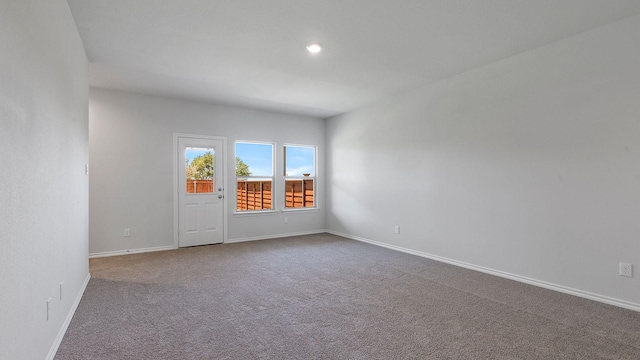 carpeted spare room with baseboards and recessed lighting