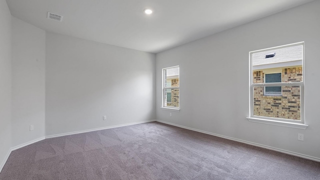 unfurnished room with baseboards, carpet flooring, recessed lighting, and visible vents
