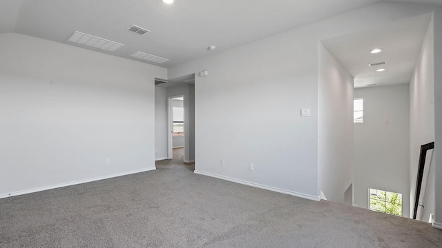 unfurnished room with plenty of natural light, carpet, and visible vents