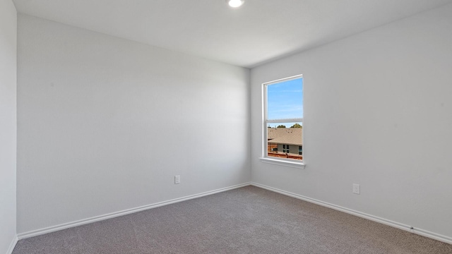 carpeted empty room with recessed lighting and baseboards