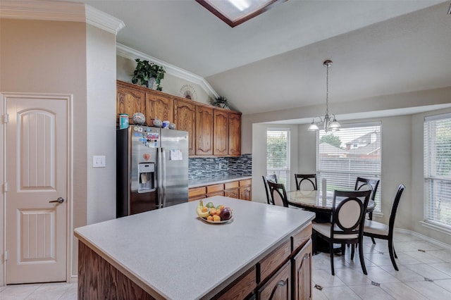 3002 Silver Springs Way, Rowlett, TX 75089 - kitchen featuring stainless steel fridge with ice dispenser, decorative backsplash, light tile patterned floors, brown cabinetry, and light countertops