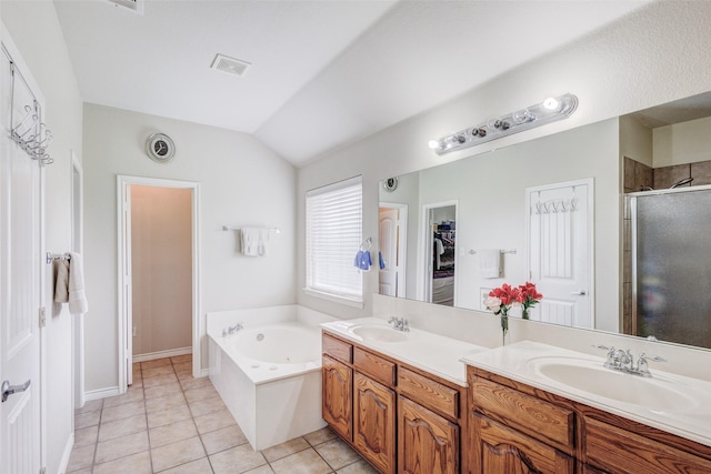 full bath with visible vents, a sink, tile patterned flooring, and a stall shower