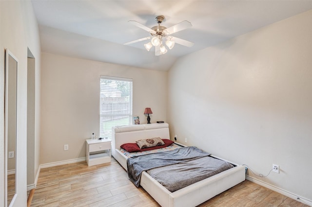 3002 Silver Springs Way, Rowlett, TX 75089 - bedroom with light wood-style floors, baseboards, a ceiling fan, and lofted ceiling