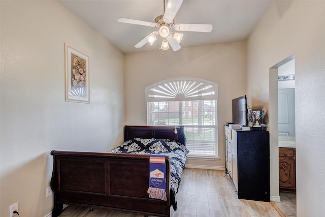 bedroom featuring light wood-style floors, baseboards, and ceiling fan