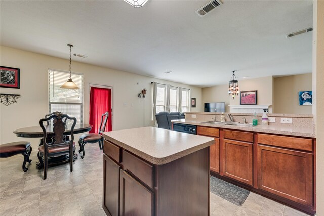 4312 Summer Star Ln, Fort Worth, TX 76244 - kitchen with visible vents, a sink, a peninsula, and light countertops