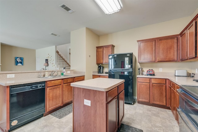 4312 Summer Star Ln, Fort Worth, TX 76244 - kitchen featuring a sink, light countertops, a kitchen island, visible vents, and black appliances
