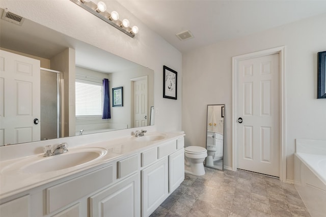 4312 Summer Star Ln, Fort Worth, TX 76244 - bathroom featuring toilet, visible vents, a sink, and a bath