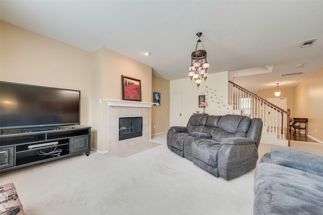 4312 Summer Star Ln, Fort Worth, TX 76244 - living room featuring carpet floors, a tiled fireplace, stairs, baseboards, and visible vents