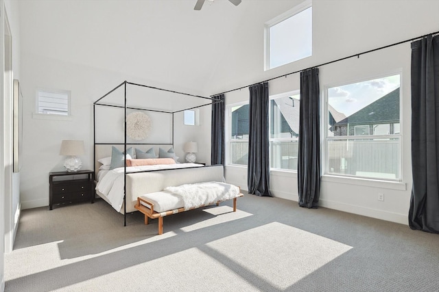 bedroom with baseboards, a ceiling fan, carpet, and high vaulted ceiling