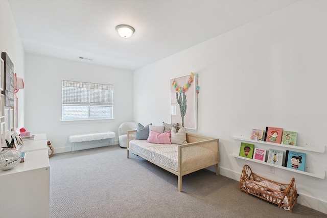 carpeted bedroom with baseboards and visible vents