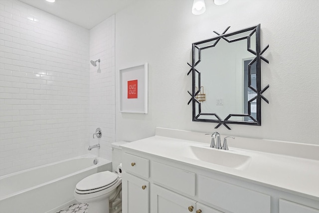 bathroom featuring vanity, bathtub / shower combination, and toilet