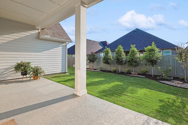 view of yard with a patio and fence