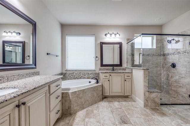 full bath featuring a healthy amount of sunlight, a garden tub, and a stall shower