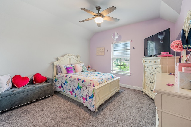 bedroom with baseboards, a ceiling fan, lofted ceiling, and light carpet