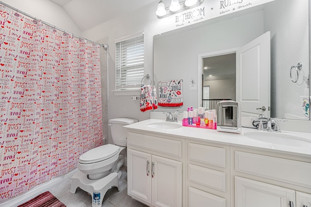 bathroom featuring double vanity, toilet, a shower with shower curtain, and a sink