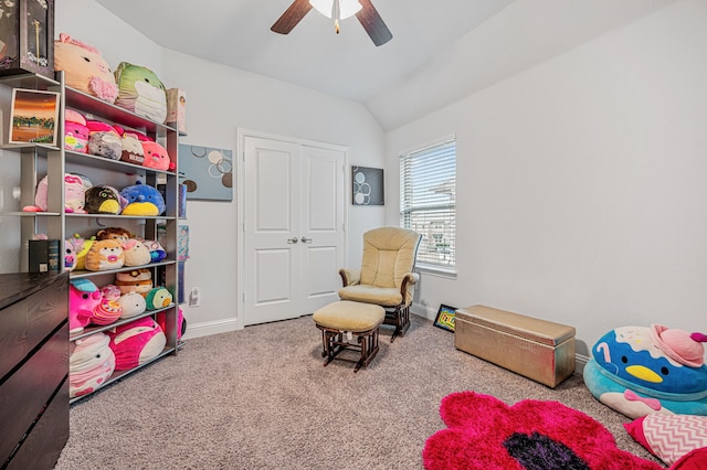 recreation room featuring baseboards, carpet flooring, ceiling fan, and vaulted ceiling