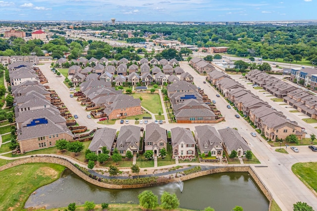 birds eye view of property featuring a water view and a residential view